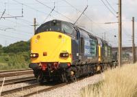 DRS 37607+37608 head south at Farington Junction with two 4 wheel flat wagons on 27 July 2013 on a Sellafield to Crewe working.<br><br>[John McIntyre 27/07/2013]