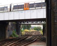 View east from the low level platforms at Willesden Junction on 20 July 2013, with a Stratford bound <I>Overground</I> service passing above on the North London Line.<br><br>[John Thorn 20/07/2013]