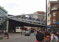 View north east along Borough High Street SE1 on 20 July 2013 towards the new viaduct. Just beyond, the lines from Charing Cross and Blackfriars meet those from Cannon Street at Borough Market Junction. London Bridge station stands off to the right. [See image 43904]<br><br>[John Thorn 20/07/2013]