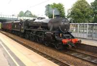 The appearance of 45407 with support coach at Leyland on 27 July 2013 was only a surprise because it should have been accompanied by 44871 and hauled by a Class 37. The two locos had set off from Fort William the night before to attend the 45th anniversary of the 15 Guinea special on the East Lancs Railway. Unfortunately, problems with 44871 (one of the engines on the original special) resulted in 45407 making its own way on the last leg of the journey, at this stage around 90 minutes late.<br><br>[John McIntyre 27/07/2013]