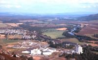 View north east over Aviemore in September 1967, with the station and locomotive shed clearly visible, as is the split of the routes to the north. The River Spey comes in on the right and meanders on its way to meet the North Sea.<br><br>[Bruce McCartney //1967]