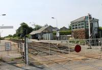 Bootle, on the Cumbrian Coast line, looking south over the level crossing. The small signal box still controls semaphores that protect the crossing.<br><br>[Mark Bartlett 27/07/2013]