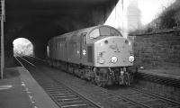 EE Type 4 No. 258 accelerates through the disused platforms at Craiglockhart station in March 1970, doubtless heading for Millerhill depot. The position of the points at Craiglockhart Junction is not entirely clear, but it looks as if the loco has come down the chord from Slateford.<br><br>[Bill Jamieson 11/03/1970]