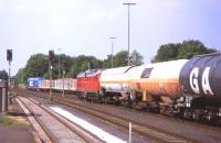 A trainload of timber (almost certainly from the Czech Republic) heading south towards Nuremberg, passes a stationary DB mixed freight at Marktredwitz in eastern Bavaria on 9th July 2013. This is one of the largest swathes of Germany with no electrified routes.<br><br>[David Spaven 09/07/2013]