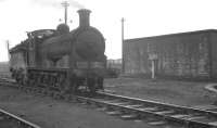 J36 0-6-0 no 65297 simmering in the yard at 64F Bathgate on 18 November 1963. The sign in the background reads <I>No ashes to be deposited between these sidings.</I><br><br>[K A Gray 18/11/1963]