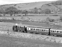 <I>Llywelyn</I> was given a lined blue livery in 1978, but this only lasted three years before the decision was made to apply 'historical' liveries to all VoR locos. This saw No. 8 appearing in GWR plain green in 1981. Apart from the GWR roundel on the cab side it was very plain indeed and, for best effect, needed to be seen coupled to a rake of chocolate and cream coaches, as here drifting down the valley at Capel Bangor in April 1983 with the 16.45 from Devil's Bridge.<br><br>[Bill Jamieson 02/04/1983]