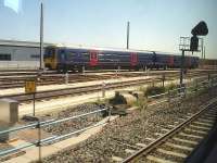 First Great Western DMU 165121 in a siding alongside the newly opened replacement Reading TMD on 1 August 2013. The new depot is sited on the up side of the main line just west of Reading station. <br><br>[David Pesterfield 01/08/2013]