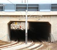 View north through the new tunnel that will take Edinburgh's trams under the A8, just to the east of Gogar roundabout. Photographed from the Gyle shopping centre car park on 6 August 2013.  Edinburgh Gateway tram stop is located just off to the left after the junction on the other side of the tunnel [see image 43397]. The second pair of lines runs to Gogar Tram Depot.   <br><br>[John Furnevel 06/08/2013]