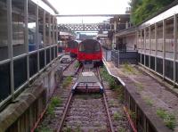 The LU Northern Line terminus at High Barnet on 5 August 2013. Looking out from the buffers at platforms 1 and 2 (#3 being out of view to the left). The wooden frames surround a level access path for wheelchair and pushchair access - the station has no lifts.<br><br>[Ken Strachan 05/08/2013]