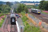 Looking east over Manuel Station on 6 August 2013, with the 12.55 to Boness waiting at the new platform behind 246 <I>Morayshire</I>.  Over on the right 170452 is passing on the E&G main line.<br><br>[Bill Roberton 06/08/2013]