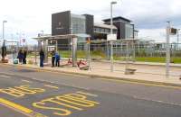 Bet a bus comes first! Adjacent bus and tram stops alongside Edinburgh Park station on 6 August 2013.  <br><br>[John Furnevel 06/08/2013]