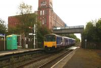 Northern 150136 departs from Shaw and Crompton for Manchester Victoria via Oldham in October 2009. For the same view less than 4 years later [see image 44104].<br><br>[John McIntyre 01/10/2009]