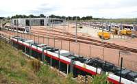 Scene at Gogar Tram Depot on 6 August 2013 looking west, with trams on training and familiarisation trips to and from Edinburgh airport.  <br><br>[John Furnevel 06/08/2013]