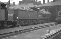 The busy shed yard at 1A Willesden, thought to have been taken in 1960. Locomotives present include 3F 0-6-0T 47304 and G2 0-8-0 49070.<br><br>[K A Gray //1960]