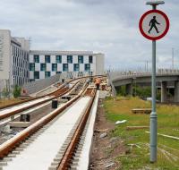 Track laying work in progress on the tram flyover at Edinburgh Park. View west from the station approach on 6 August 2013. <br><br>[John Furnevel 06/08/2013]