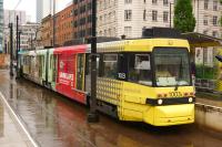 The only first generation Manchester tram to receive the latest <I>Metrolink</I> livery, no 1003, arriving at the tram stop in St Peter's Square on 31 July with a service to Altrincham.<br><br>[John McIntyre 31/07/2013]