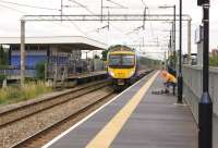 A First TransPennine service to Manchester Airport passes East Didsbury station on 31 July 2013.<br><br>[John McIntyre 31/07/2013]
