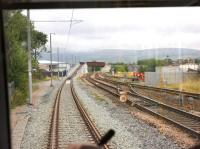 Although the Metrolink doesn't share Rochdale railway station with the national network, it does run parallel to the main line for a short distance to the north of the station before climbing over the tracks and joining the original formation towards Milnrow. View from behind the driver on 31 July 2013 reminding me of the days travelling on First Generation DMUs and EMUs.<br><br>[John McIntyre 31/07/2013]