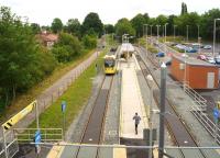 East Didsbury tram terminus (for the moment at least) on 31 July 2013 viewed from Kingsway road bridge looking east along what had been the former Midland Railway route towards Heaton Mersey station.<br><br>[John McIntyre 31/07/2013]