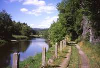 Immediately beside the old Iron Curtain formed by the River Saale (with Bayern to the left and Thuringen to the right), the track of a long-abandoned horse-drawn narrow-gauge railway - linking paper mills in Bad Blankenburg with the nearby standard-gauge railway at Blankenstein - still survives as a footpath on 8th July 2013.<br><br>[David Spaven 08/07/2013]