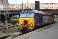 DRS 57309 in the bay at the north end of Preston on 11 August. Also of interest is the London Midland emu in the left background. 350252 has been based at Preston for a week and is running trials and familiarisation runs to Carlisle in preparation for First TransPennine receiving some 350/4 units to operate the Manchester Airport to Edinburgh and Glasgow services.<br><br>[John McIntyre 11/08/2013]