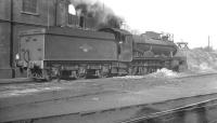 Hall class 4-6-0 no 4972 <I>Saint Bride's Hall</I> alongside the coaling stage at Exeter ex-GW shed in October 1961.<br><br>[K A Gray 05/10/1961]