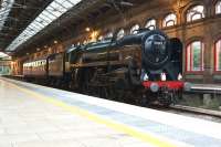 70013 <I>Oliver Cromwell</I> with support coach at Preston station on the evening of 11 August 2013, having earlier hauled the 1T57 charter to Carlisle. The Pacific was in the process of taking on water before continuing the journey south to Crewe. <br><br>[John McIntyre 11/08/2013]