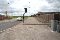 The site of Kelso station, looking towards Roxburgh in 2013. Half a century after closure there is little to indicate a station ever existed here, with the site cleared and the trackbed becoming part of the A698. Even the bridge that spanned the line was removed and replaced with a road junction. The only surviving link is the building in the background [see image 31572]. Today the road junction itself has been replaced by a roundabout and a large Sainsburys Superstore now stands just off to the left.  <br><br>[John Furnevel 13/08/2013]