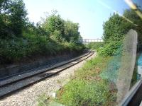 Looking along the west to east Landore curve that allows through workings (such as the 10.57 Cardiff to Fishguard and return limited stop service) to avoid reversal at Swansea. View from a train heading into Swansea from West Wales. [With thanks to Messrs Morgan, Taylor, Armit, Rafferty and Roberts]<br><br>[David Pesterfield 16/07/2013]