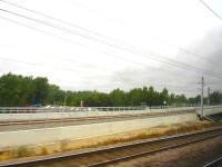 The southern approach ramp to the recently opened Hitchin flyover in August 2013. The new flyover, just north of Hitchin station, allows northbound Cambridge and Kings Lynn services to cross over the ECML without impeding other train movements.<br><br>[David Pesterfield 09/08/2013]