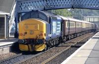 DRS 37409 roars through Dunblane on 21 July on the rear of a <I>Northern Belle</I> empty stock movement from Aberdeen to Crewe. At the front of the train are DRS 37425 and 37437.<br><br>[Bill Roberton 21/07/2013]