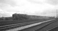 BR Standard class 9F 2-10-0 no 92076 takes a lengthy freight past Kingmoor on 15 April 1965. The locomotive was withdrawn from here in February 1967, a month short of its eleventh birthday. <br><br>[K A Gray 15/04/1965]