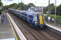 The 15.50 from Glasgow Central to North Berwick, formed by 380103, arrives at Longniddry on 17 August 2013.<br><br>[Bill Roberton 17/08/2013]