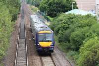 Shortly after leaving South Gyle station (in background) on 6 August 2013 the 10.17 Newcraighall - Glenrothes with Thornton is about to pass below the bridge carrying the A8, following which it will run through the site of the planned train/tram interchange station at Gogar - to be called Edinburgh Gateway. [See image 35080]<br><br>[John Furnevel 06/08/2013]