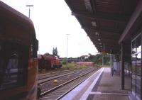 At Bautzen (Sachsen) on 2nd July 2013 an ODEG local service from Bischofswerda to Goerlitz waits for the incoming Regional-Express from Dresden, while a westbound mixed freight pauses in the yard. Bautzen is an ethnic enclave of the Sorbian culture and language and sports a preserved static DR steam locomotive in the station forecourt.<br><br>[David Spaven 02/07/2013]