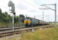 Now a West Coast locomotive, but still in Arriva blue livery, former <I>Thunderbird</I> 57316 stands in one of the down WCML loops at Carnforth prior to working an ECS train to York via Bentham.<br><br>[Mark Bartlett 20/08/2013]