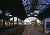 Goerlitz - the most easterly town in Germany - once played host to international expresses from Cologne, Munich, Krakow and Warsaw at its 12-platform station, but today's fare is more modest. ODEG (Ostdeutsche Eisenbahn GmbH) railcars from Bischofswerda (left) to Goerlitz and from Cottbus to Zittau (right) approach the town's still-impressive trainshed with its six surviving platforms, on 2nd July 2013.<br><br>[David Spaven 02/07/2013]