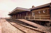 An unusual view of the now demolished station at Tiverton Junction showing the old bay platform for the Exe Valley branch. Scene in April 1986, a month before the station was closed to be replaced by Tiverton Parkway [see image 35388].<br><br>[Ian Dinmore /04/1986]