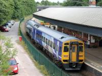 Another view of Poulton station that may not be possible when the catenary masts are erected. Unit 158905, calling on a Blackpool to York service, photographed on 10th August 2013 from alongside the street level booking office.<br><br>[Mark Bartlett 10/08/2013]