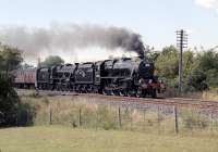 Following a two and a half hours sojourn in Carlisle, 44932 and 45231 head <I>The Fellsman</I> back south between Howe & Co's. Siding box and Cotehill on 7 August. They are already well into their stride, which with class 10 power available they should be - one Black 5 is quite capable of running the train to time.<br><br>[Bill Jamieson 07/08/2013]