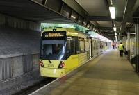 A pair of Metrolink 3000 series trams waits briefly in the Bury terminus before returning to Altrincham via Manchester. The station was opened in 1980 and served by the Bury electric trains for twelve years. [See image 40984] for the scene before conversion to tram operations. <br><br>[Mark Bartlett 31/07/2013]