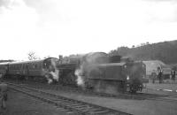 Ivatt 2-6-0 43121 at Langholm on 26 March 1967 with the SLS/BLS Scottish Rambler no 6. Immediately to the right of the tender is a young Bruce McCartney - whose camera was <I>on the blink</I> at the time!<br><br>[K A Gray 26/03/1967]