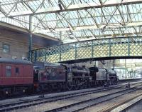 44932 and 45231 bring <I>The Fellsman</I> to a halt in platform 3 at Carlisle on 7 August. To commemorate the 45th anniversary of the end of BR steam and the very last working on 11th August 1968, it was carrying the 1T57 reporting number of the <I>Fifteen Guinea Special</I>, albeit the actual number allocated in 2013 was 1Z52.<br><br>[Bill Jamieson 07/08/2013]