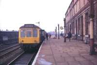 Scene at Rochdale in 1972, looking towards Littleborough. The DMU is<br>
about to set off round the Oldham loop, at that time under threat of closure. The now demolished 1889 station building is seen here following removal of the platform canopies. [See image 27221]<br><br>[Mark Bartlett //1972]