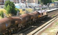 EWS 66040 takes a freight north through the centre road at Kensington Olympia towards Willesden Junction on a fine summer evening in July 2005.<br><br>[John Furnevel 24/07/2005]