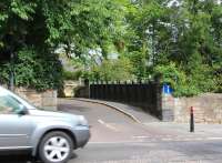 A car heading east into Dalkeith along the busy A6094 on 28 August speeds past the bridge that once carried Cemetery Road over the trackbed of the E&DR just west of Dalkeith station. A supermarket and car park are currently being built on the old station site and this bridge is now the only significant surviving artifact from the 1838 Dalkeith branch. [See image 39723]<br><br>[John Furnevel 28/08/2013]