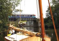 A Norwich - Sheringham DMU crosses the River Bure at Wroxham, Norfolk, in April 2006.<br><br>[Ian Dinmore /04/2006]