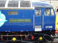 <I>County of Staffordshire</I> nameplate attached to 57308, now freshly repainted in DRS livery, seen stabled near Crewe platform 12 whilst on 'Thunderbird' standby duty on 30 August.<br><br>[David Pesterfield 30/08/2013]