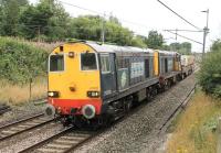 DRS 20308 and 20303, taking two nuclear flasks from Crewe to Sellafield with a load for reprocessing, seen on the WCML just north of Barton and Broughton station on 21 August. The guard is presumably enjoying the forward view from the driver's seat of 20303.<br><br>[Mark Bartlett 21/08/2013]