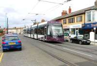 <I>Flexity</I> 011 makes its way along North Albert St in Fleetwood town centre on 10 August heading for Blackpool Starr Gate. The tram is just passing one of the numerous crossovers that allow flexible working when the main running lines are disrupted for any reason. <br><br>[Mark Bartlett 10/08/2013]